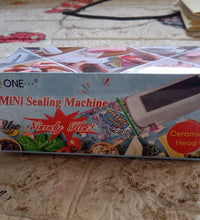 Handheld mini sealer for plastic bags