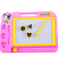 Kids using magnetic drawing board