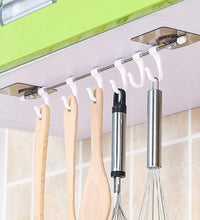 Adhesive hanger hooks, plastic, for organizing items securely.