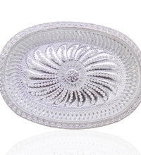 Oval silver serving tray with royal design for upscale presentation.