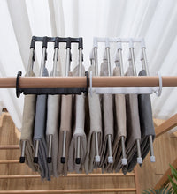 Space-saving trouser hanger with adjustable arms for versatile storage