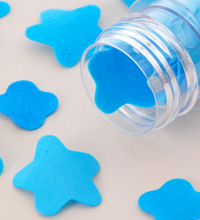 Flower-shaped paper soap strips in a compact test tube bottle.