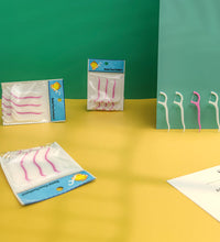 Dental floss toothpick sticks for easy oral care.