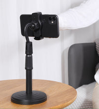 Desktop mobile stand, height adjustable, ideal for hands-free phone usage on tables.