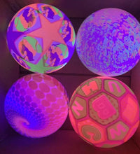 Stress relief ball for kids with LED lights, showing its use and bounciness