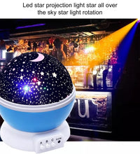 Rotating projection night lamp with star patterns