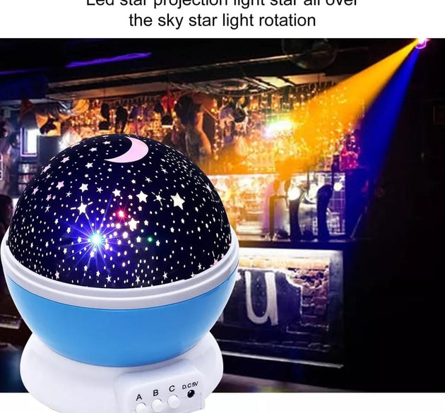 Rotating projection night lamp with star patterns