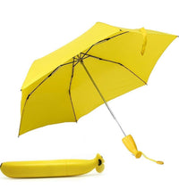 Banana-shaped mini umbrella, foldable and trendy design.