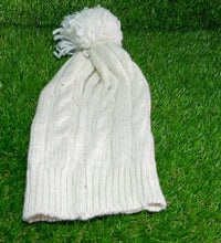 Winter woolen knitted beanie cap with black fur.