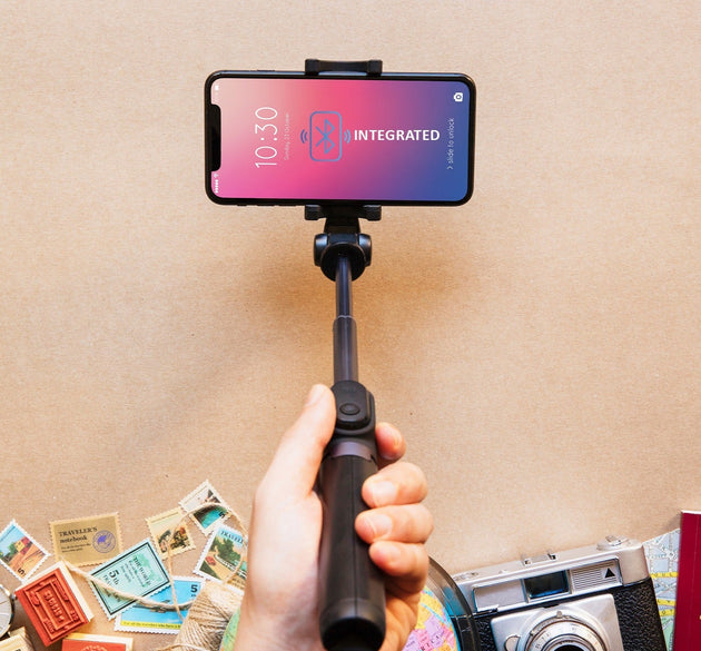 Folded selfie stick with phone holder and Bluetooth remote