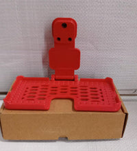 Multi-purpose wall holder in red.