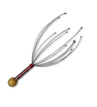 Handheld scalp massager for stress relief and relaxation.