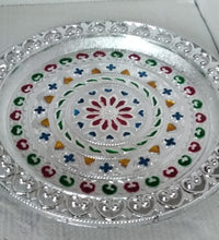 Silver plated pooja thali for religious ceremonies.