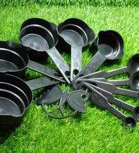 Plastic measuring cups and spoons set with a butterfly-shaped holder, highlighting its design