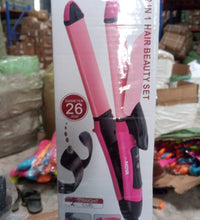 Multi-function hair straightener and curler.