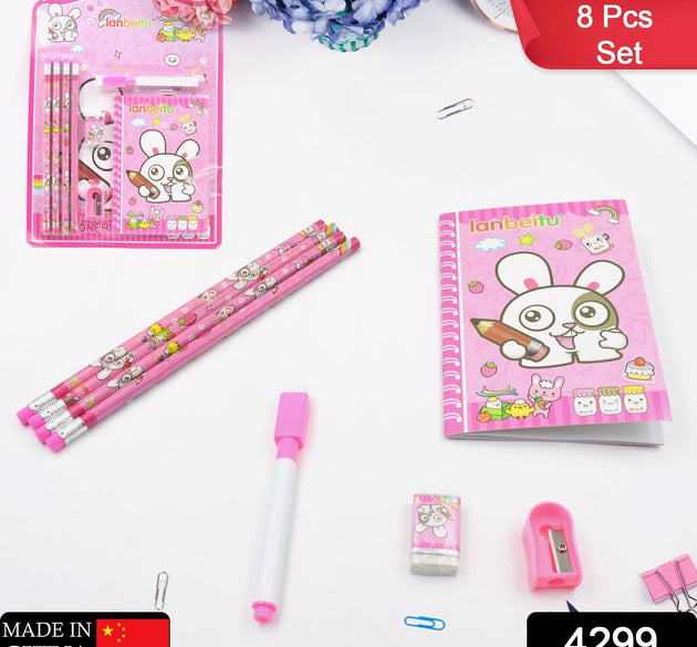 Kids' stationery kit with wooden pencils, sharpener, and eraser.