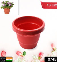 13 cm plastic plant container, heavy-duty, for indoor or outdoor decor, sold individually.