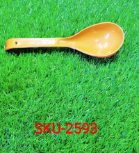 Plastic spoon for serving.