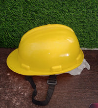 Yellow plastic safety cap for construction, offering reliable head protection.